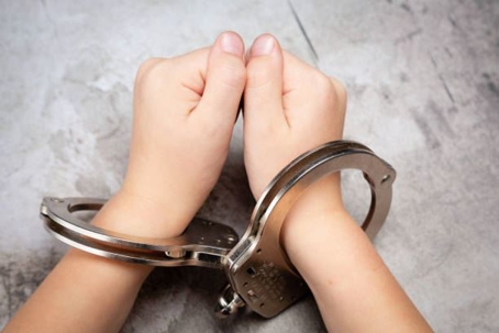 Juveniles hands in handcuffs